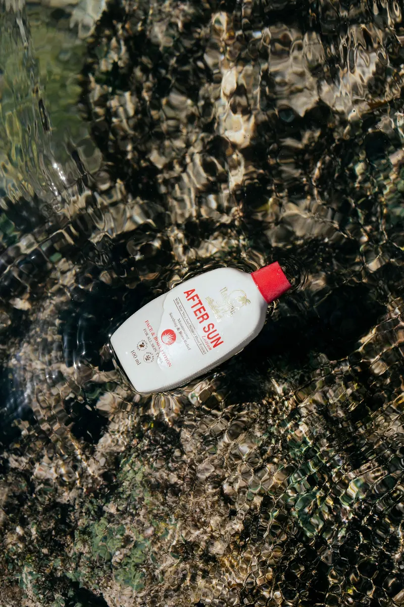 Hawaiian Style After Sun Lotion floating in a clear tide pool